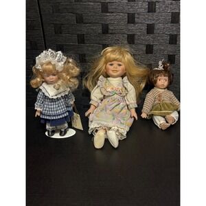 Lot of 3 porcelain dolls see pictures